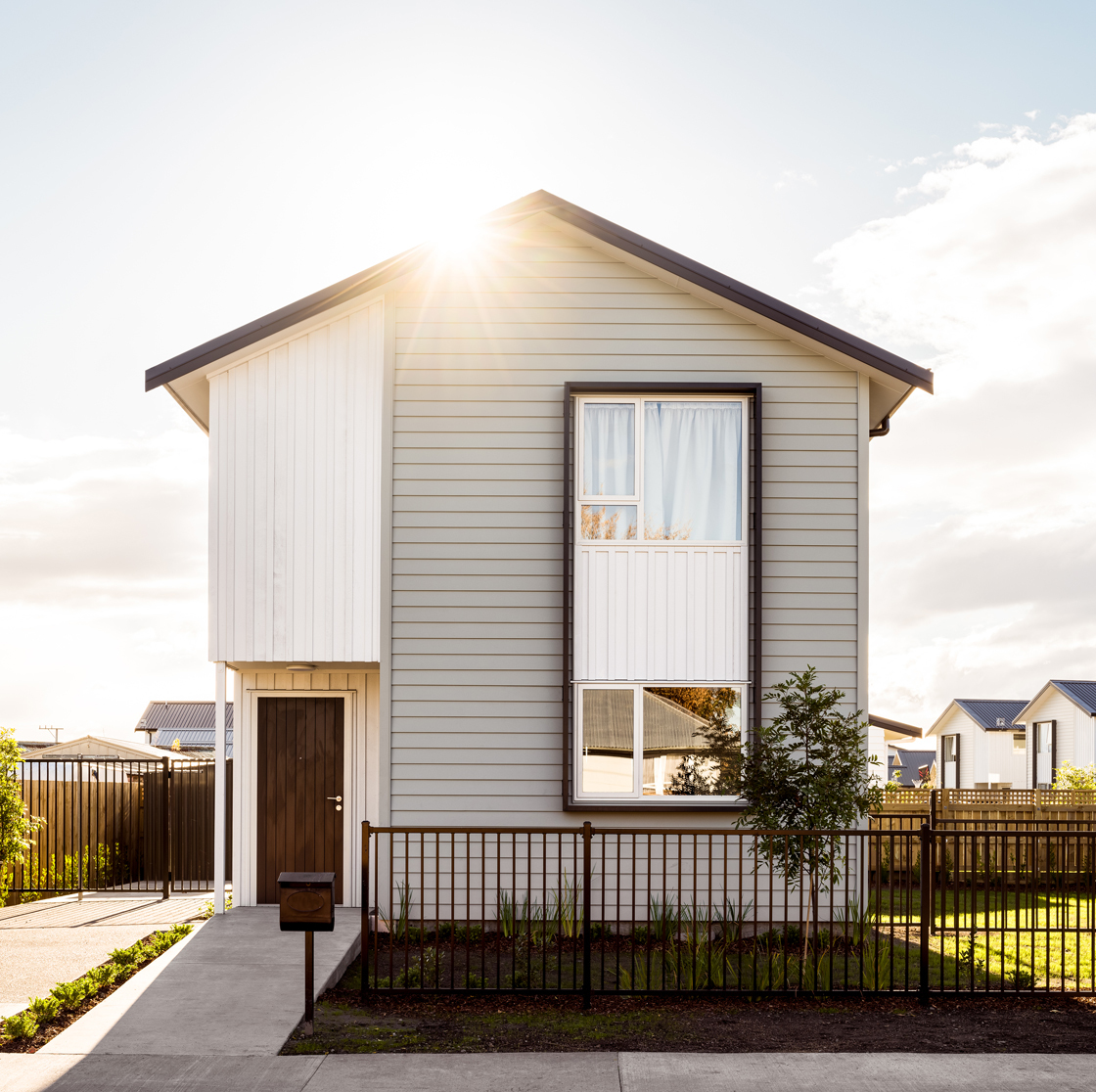 Home Capital Partners – sunlight shining over a newly built single-family home, symbolising hope and investment in housing.