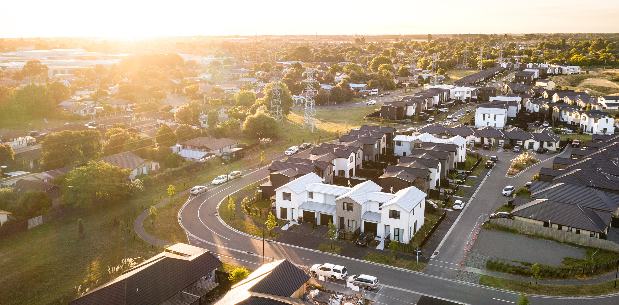 Elevated view of Karamū housing units from another angle, emphasizing the layout of homes and driveways.